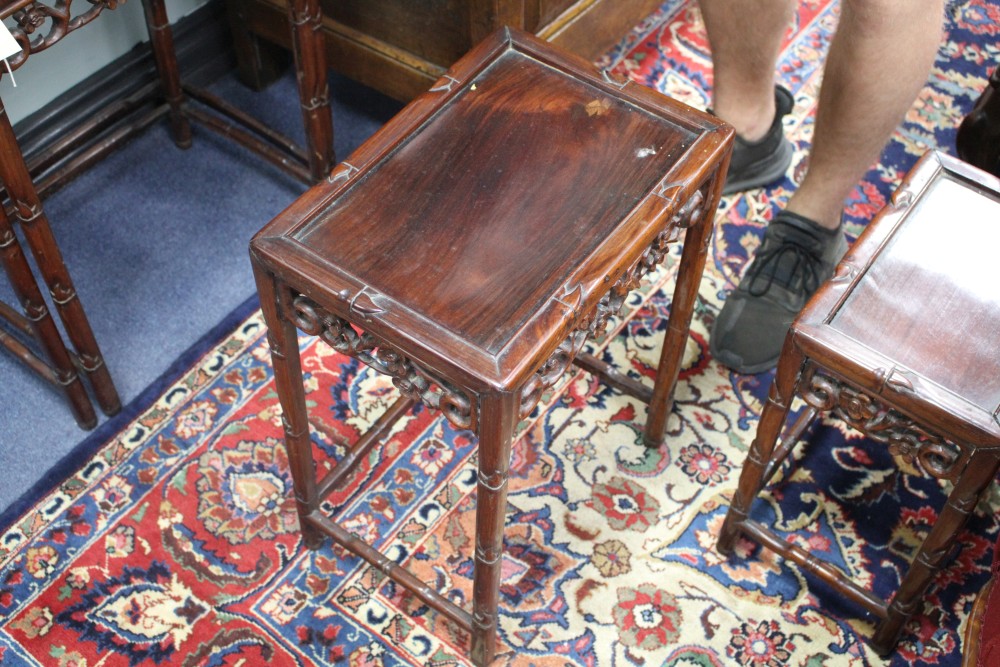 A nest of four 19th century Chinese carved pierced hardwood tables, W.50cm D.36cm H.71cm